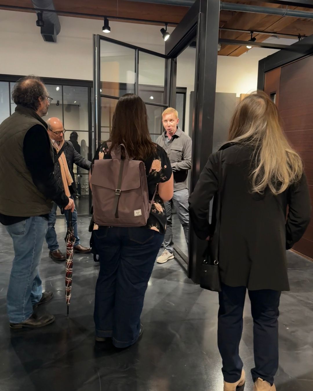 Glenview Haus shows steel-framed glass doors and custom entry doors at 303 W. Erie St.